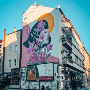 colorful urban mural on building wall in city