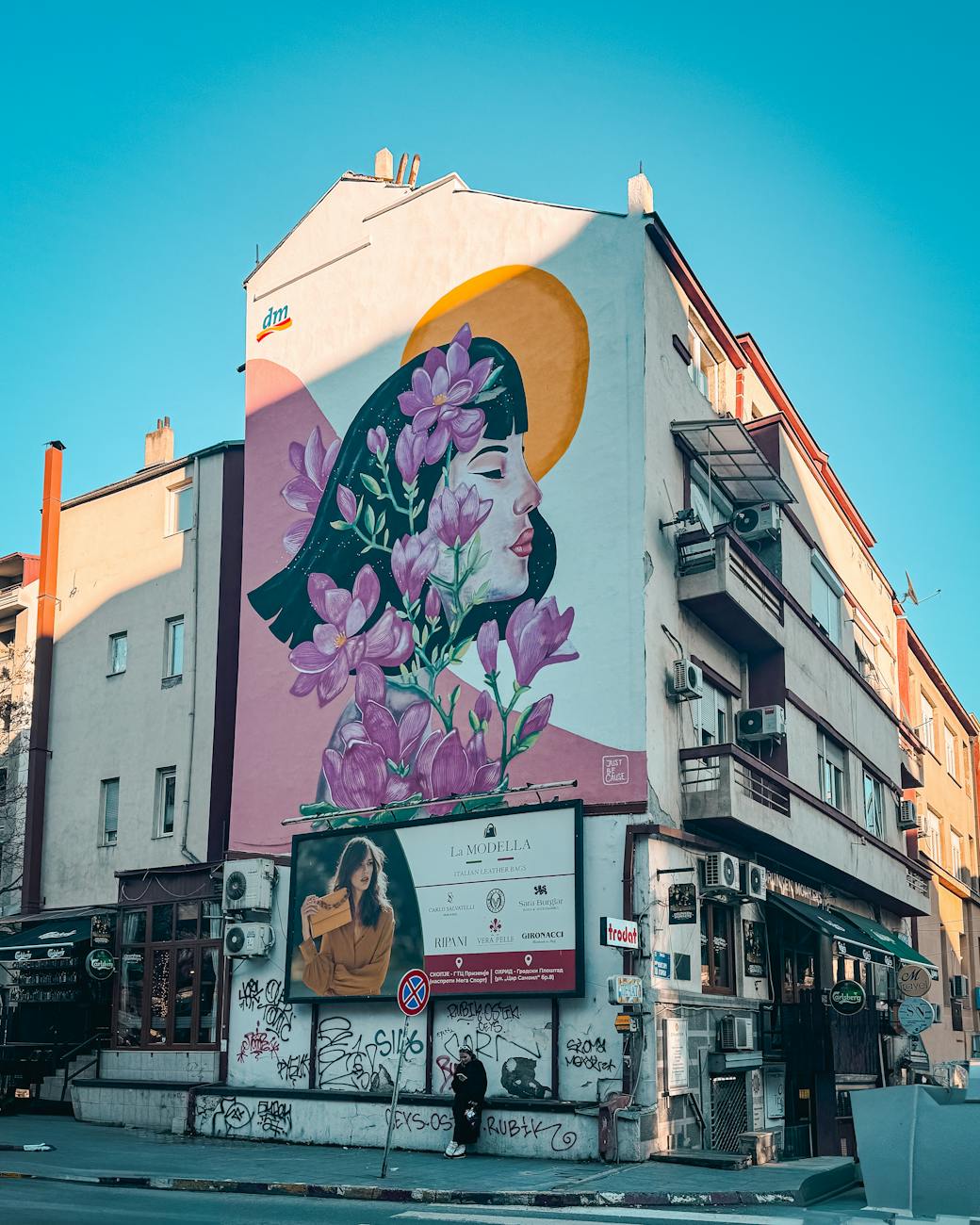 colorful urban mural on building wall in city