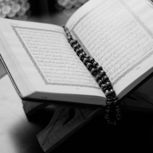 monochrome photo of opened quran